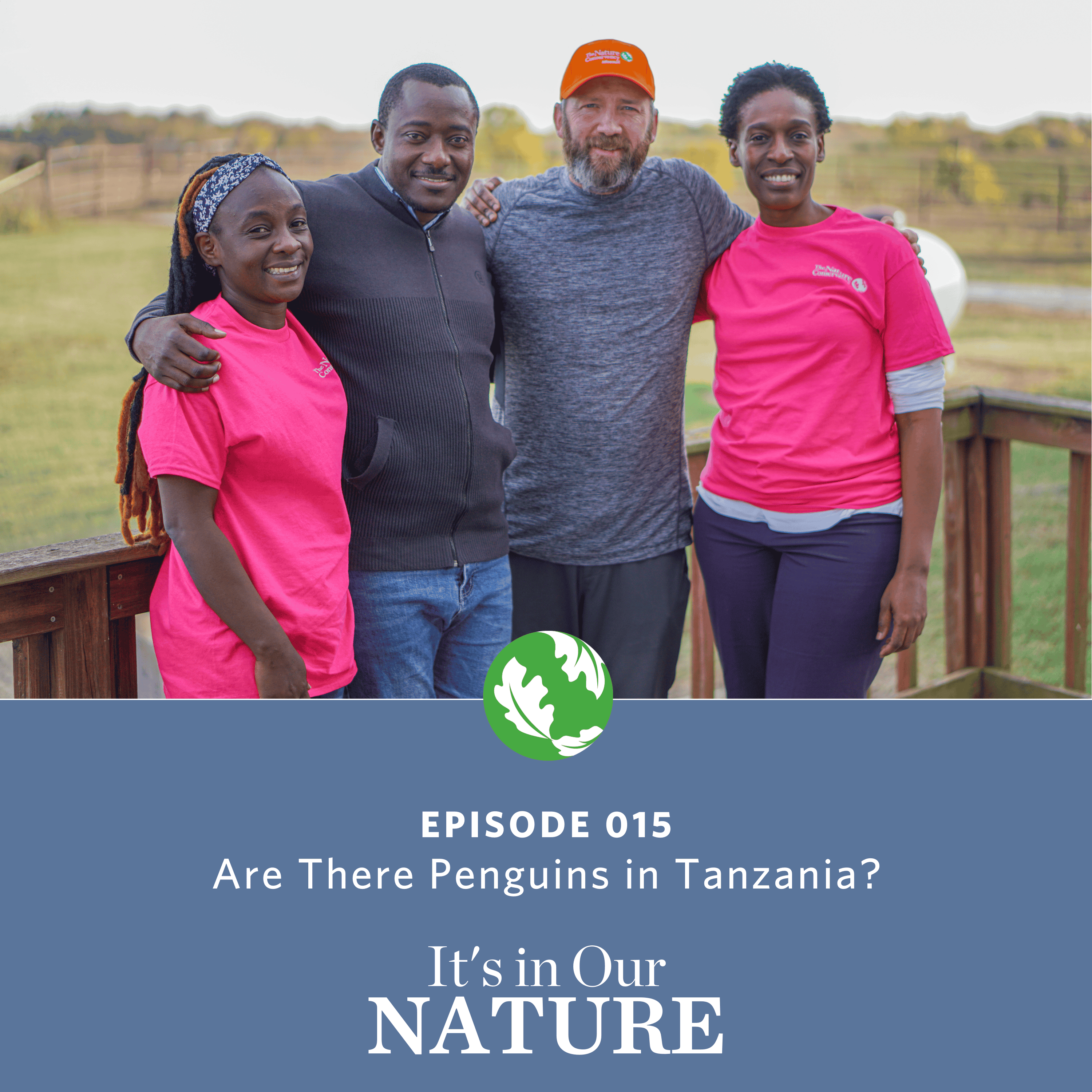 A group of four people standing on a deck smiling for the picture.