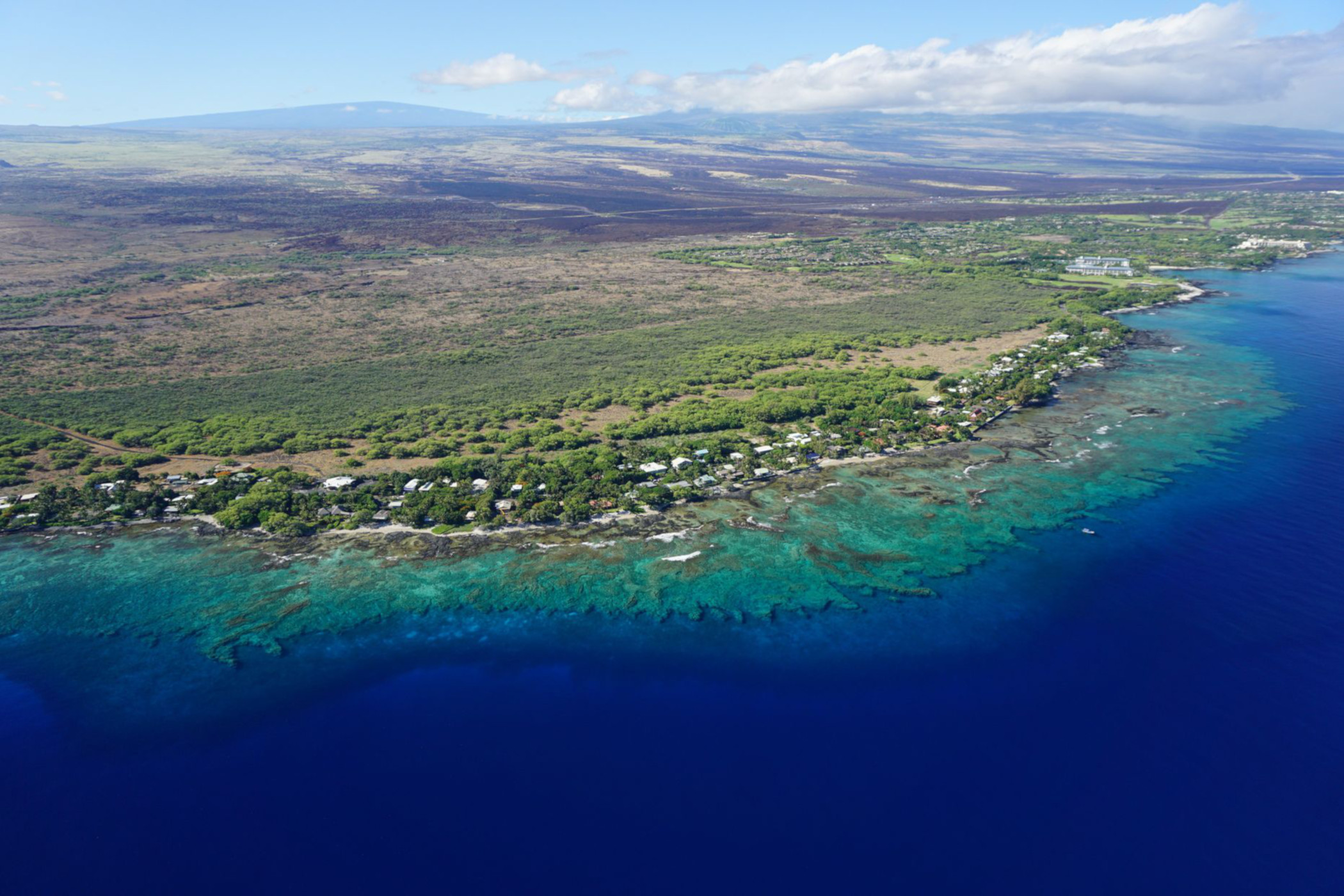 Aerial view of Puakō, Hawai‘i, and its coastal reef.