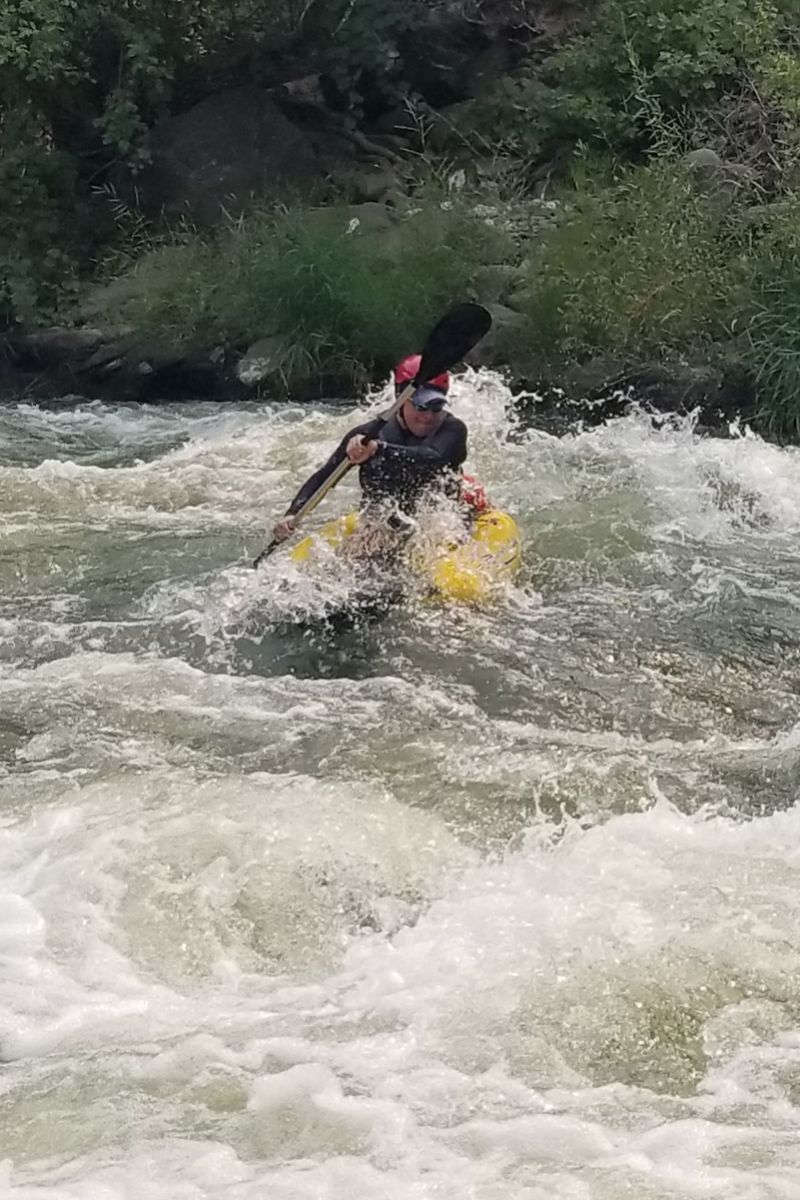 Garth Lindley riding a rapid on Cache Creek.