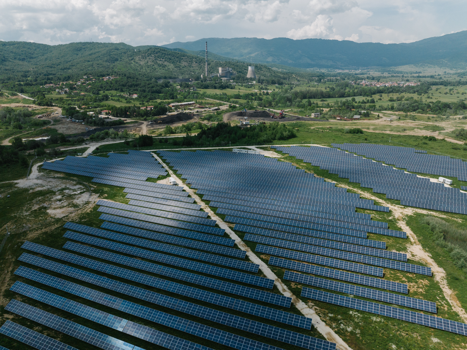 aerial of solar farm in a countryside.