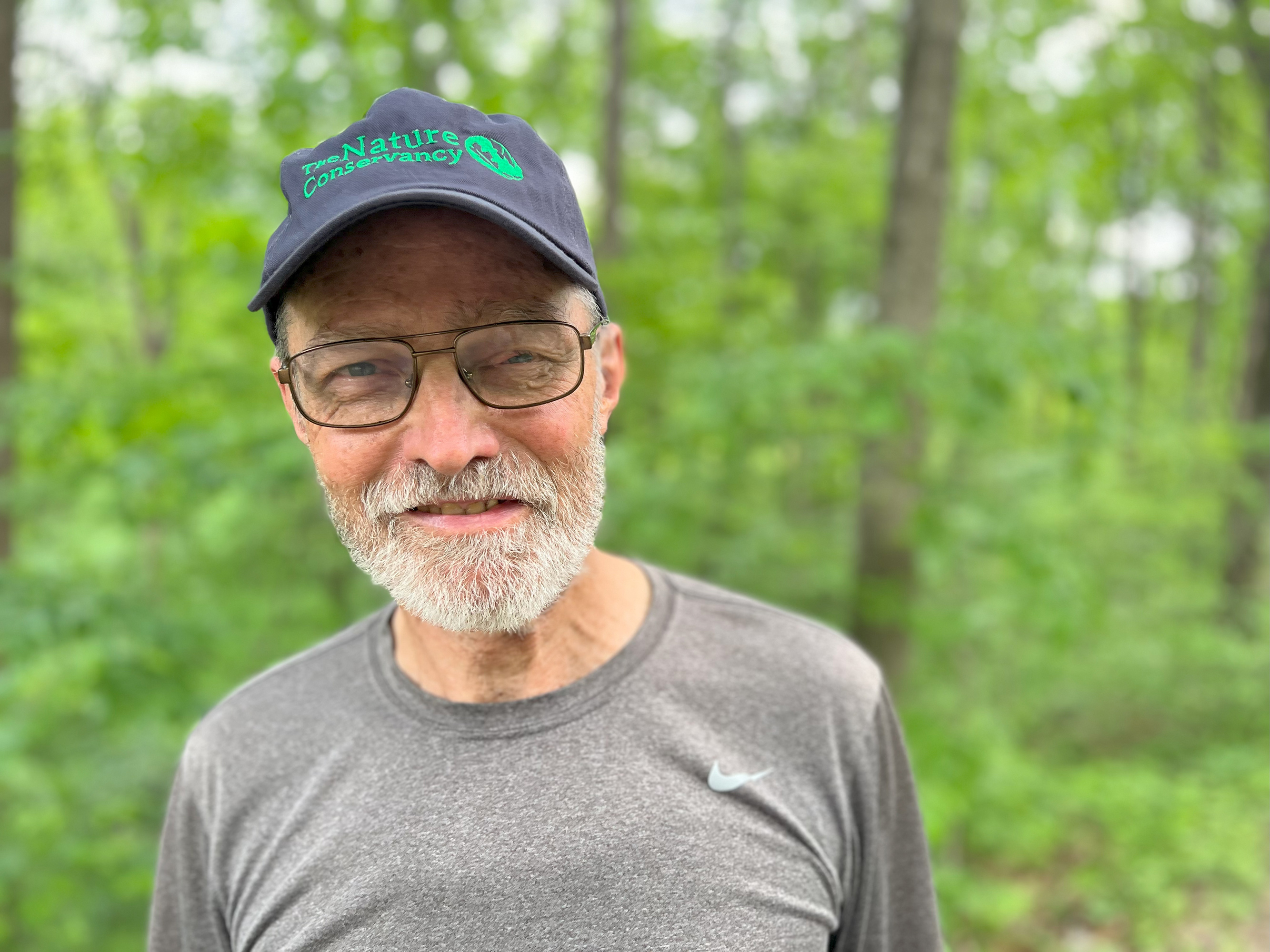 Close-up of TNC volunteer Andy Thieneman, wearing The Nature Conservancy ballcap.