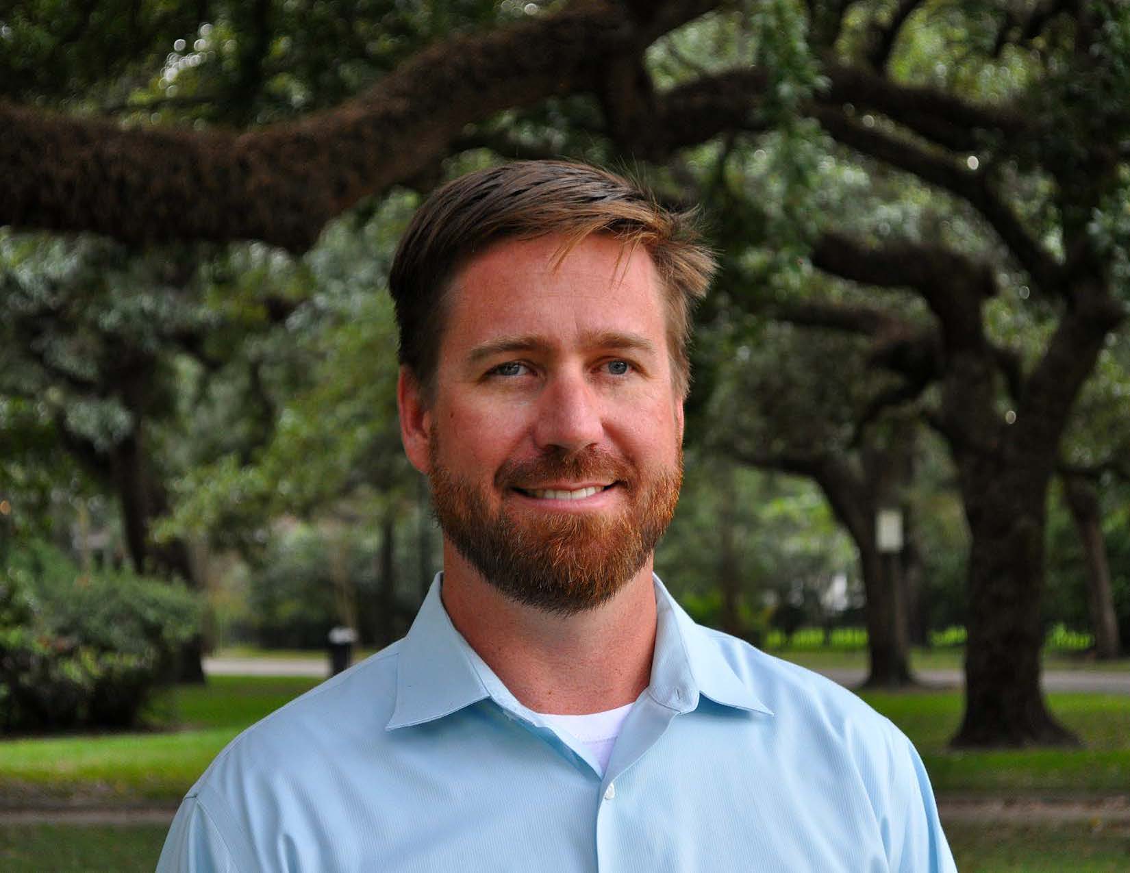 Jeff DeQuattro smiles for his portrait.