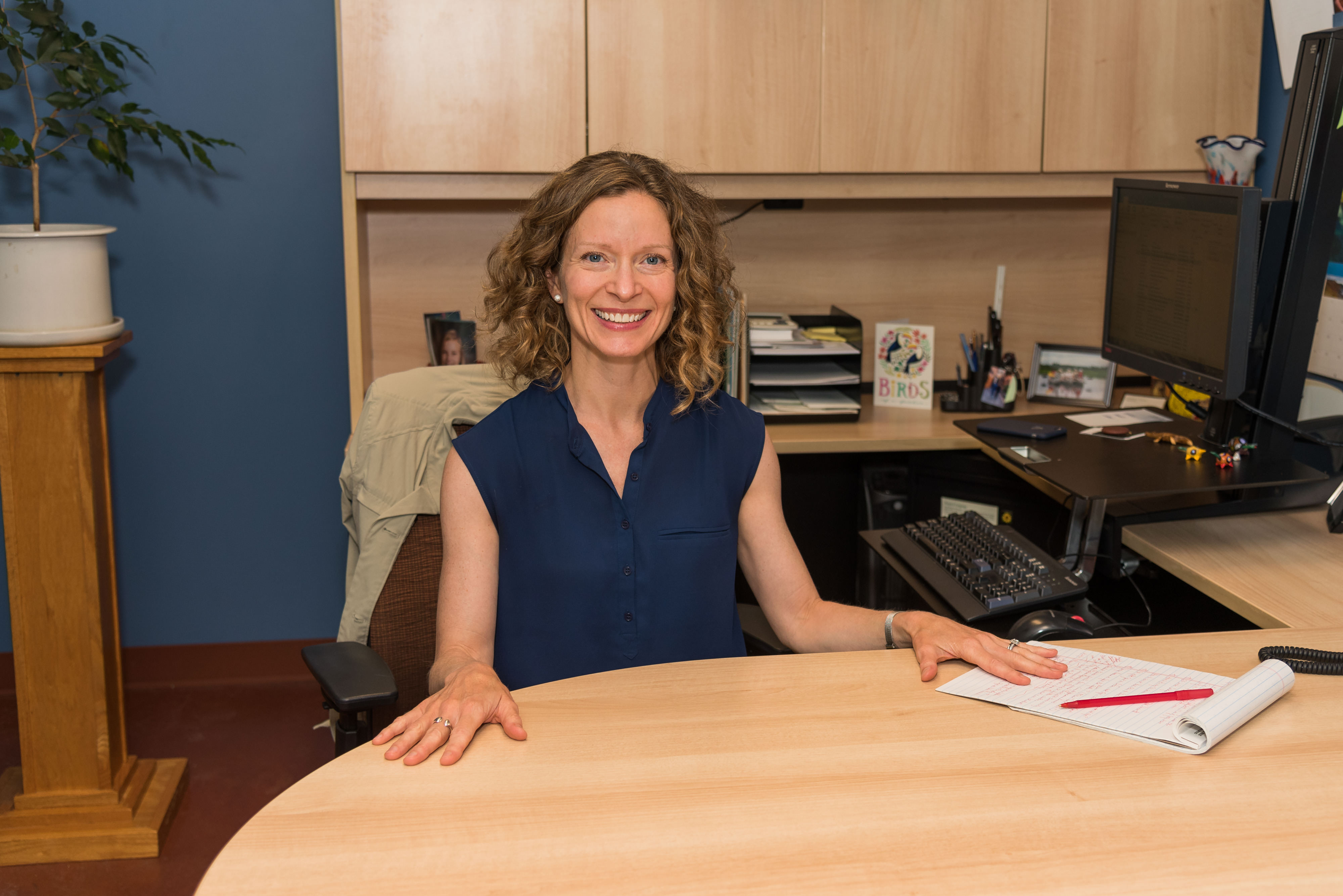Elizabeth Koehler sitting at a desk.