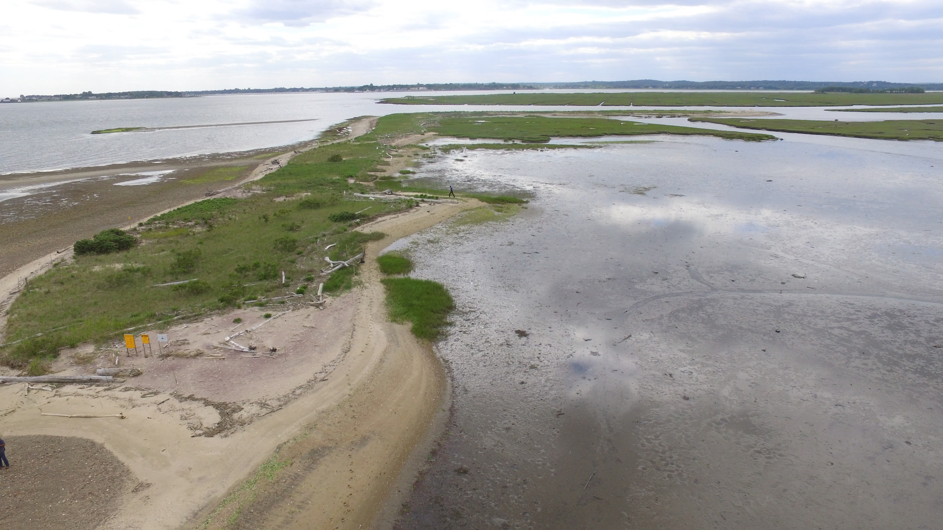 Calm waters surround a sandbar.