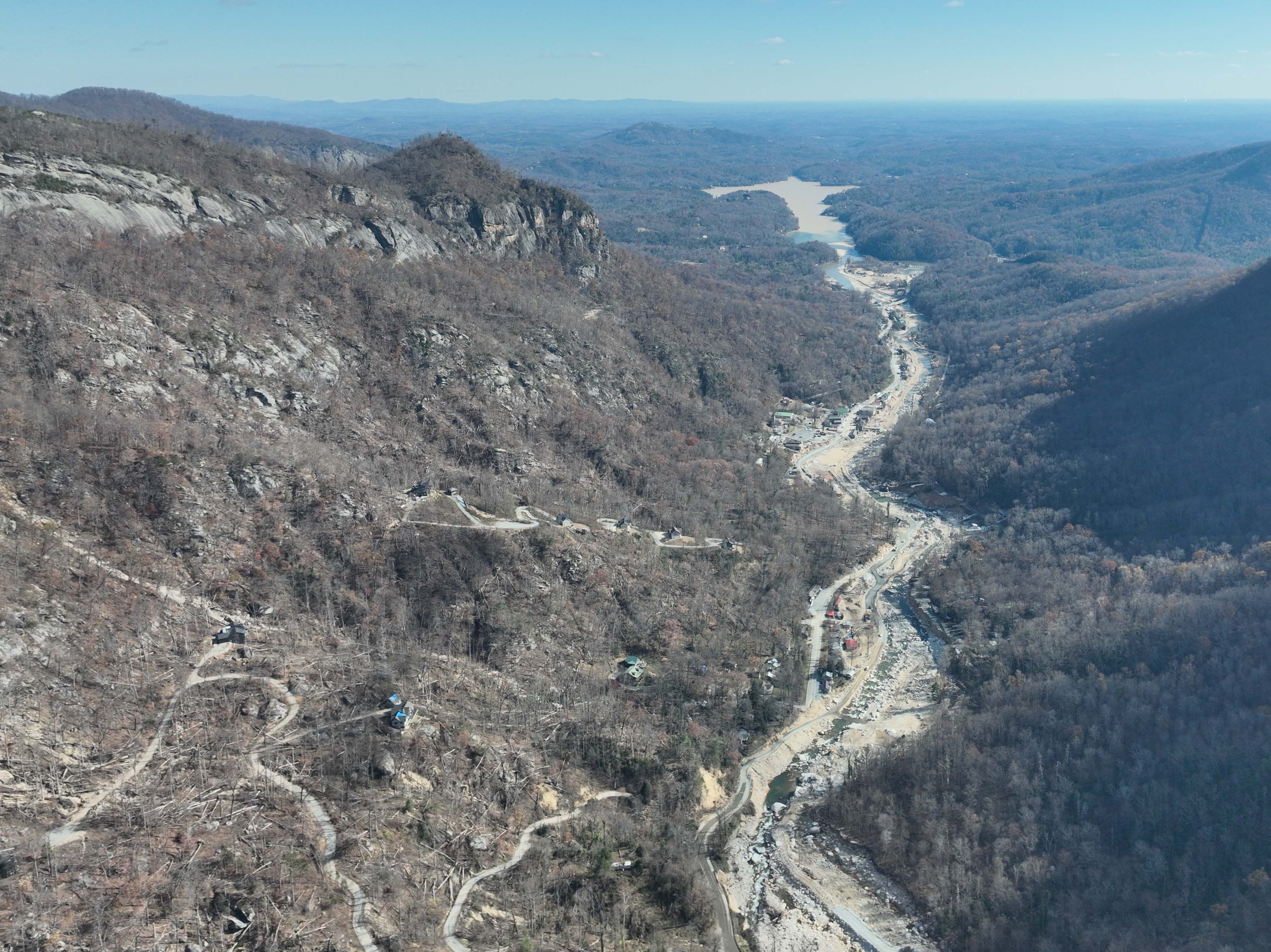 An aerial view of a river gorge devastated by flooding.