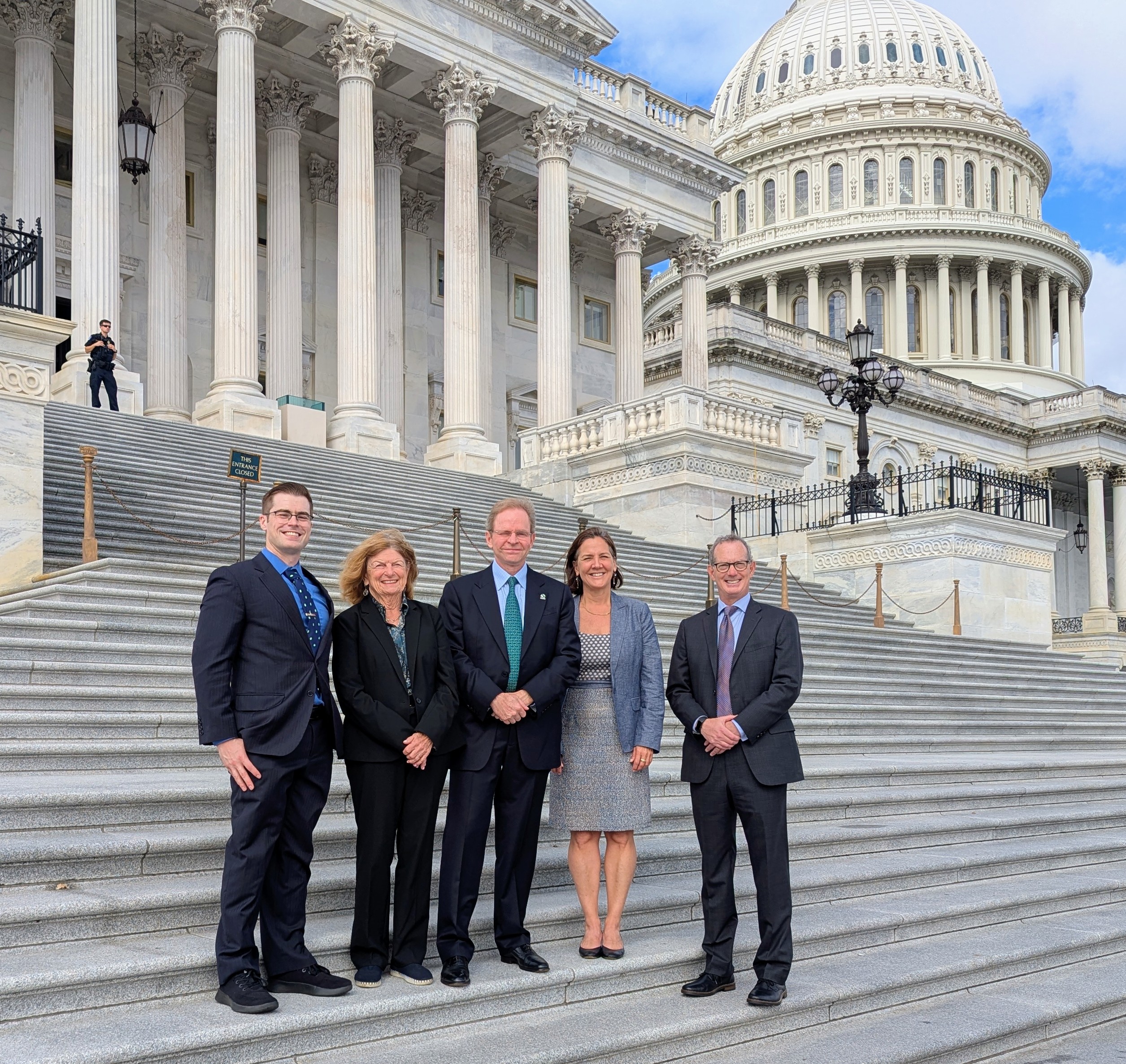 TNC in Massachusetts staff and Trustees stand on the stairs outside Capitol Hill for Advocacy Day.