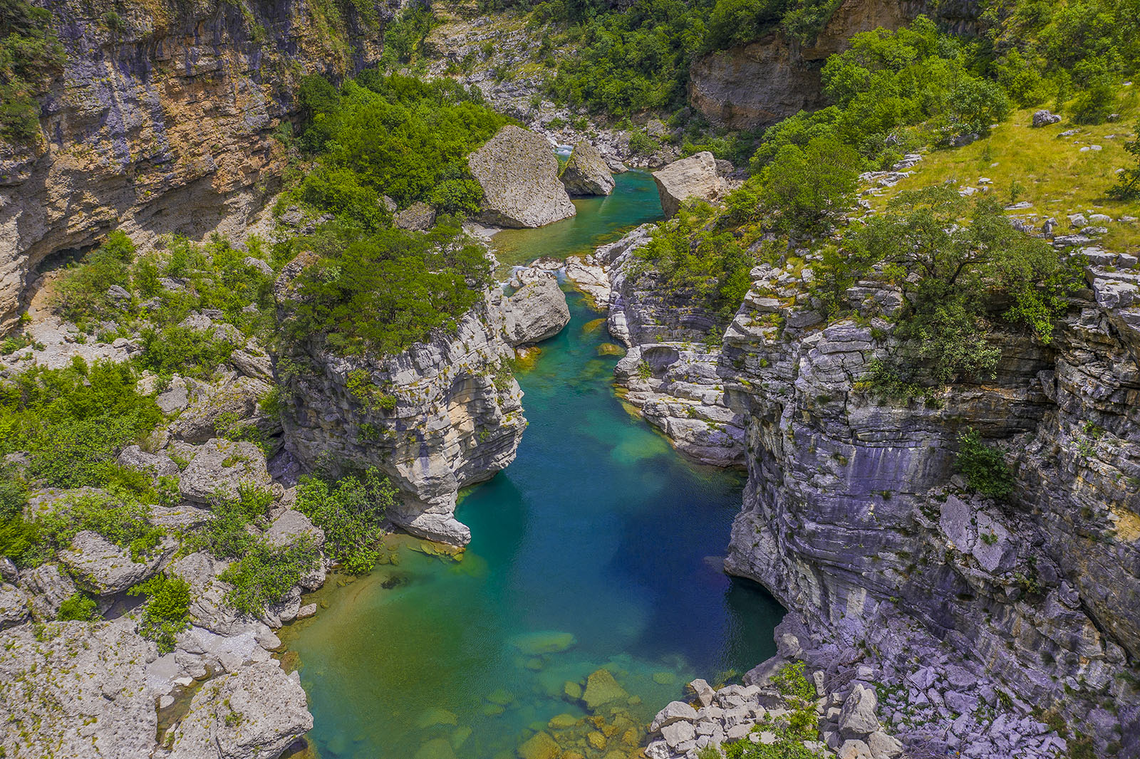 River pools amongst rural cliffs.