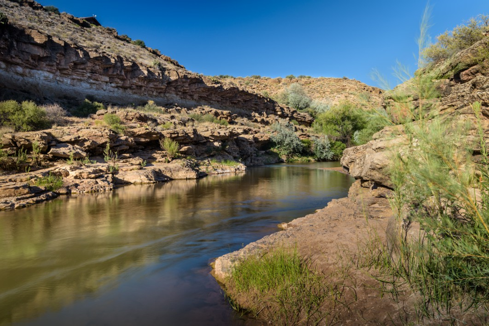 A river winds through a rocky canyon.