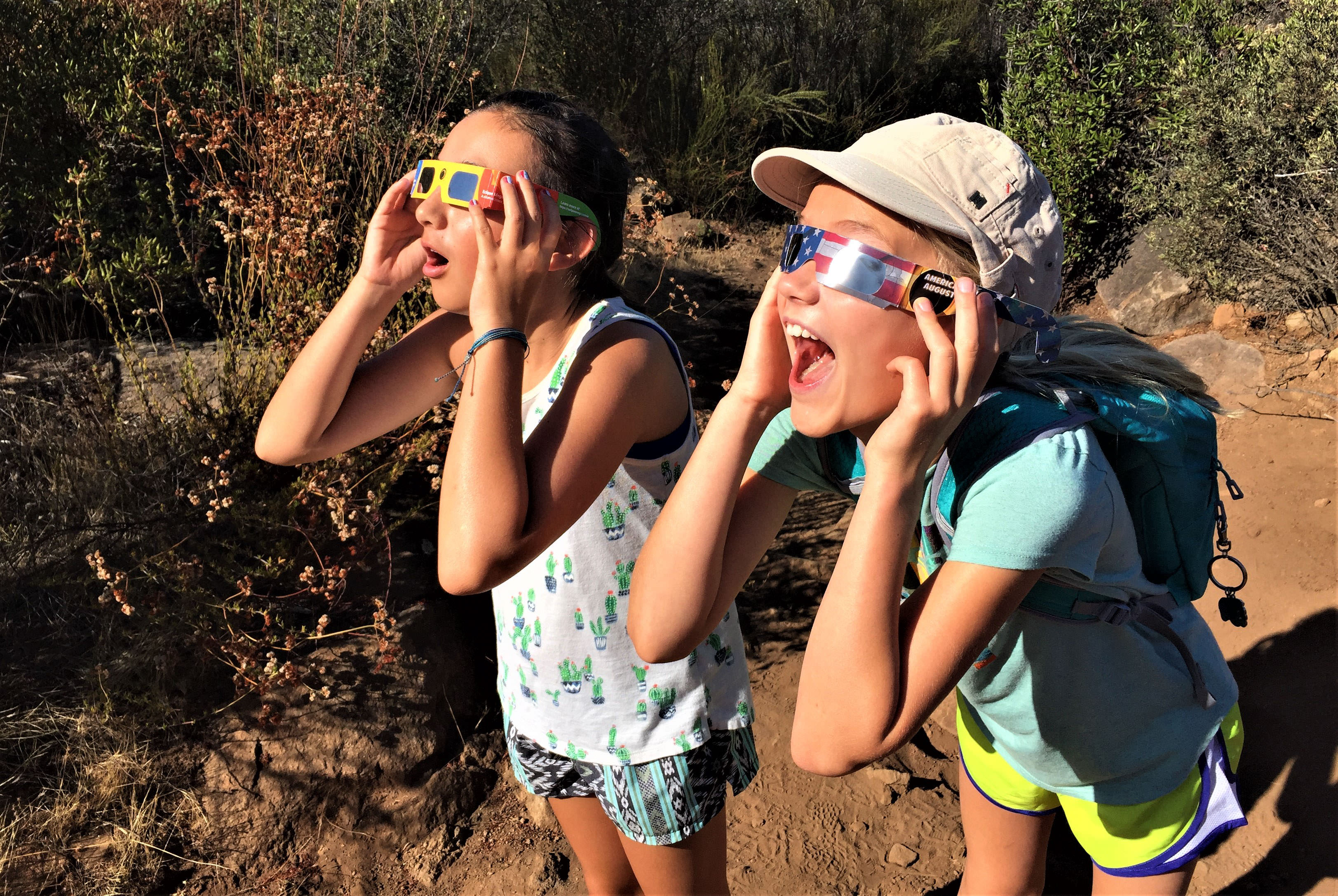 Two adorable kids with solar eclipse glasses at Oakoasis County Preserve.
