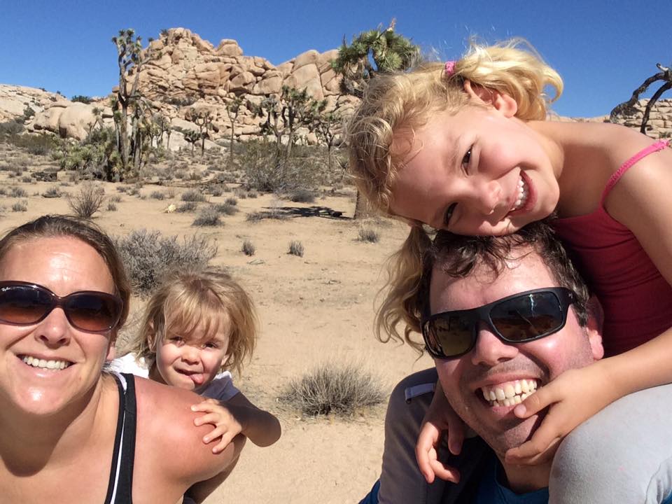 A family hiking in Joshua Tree. 