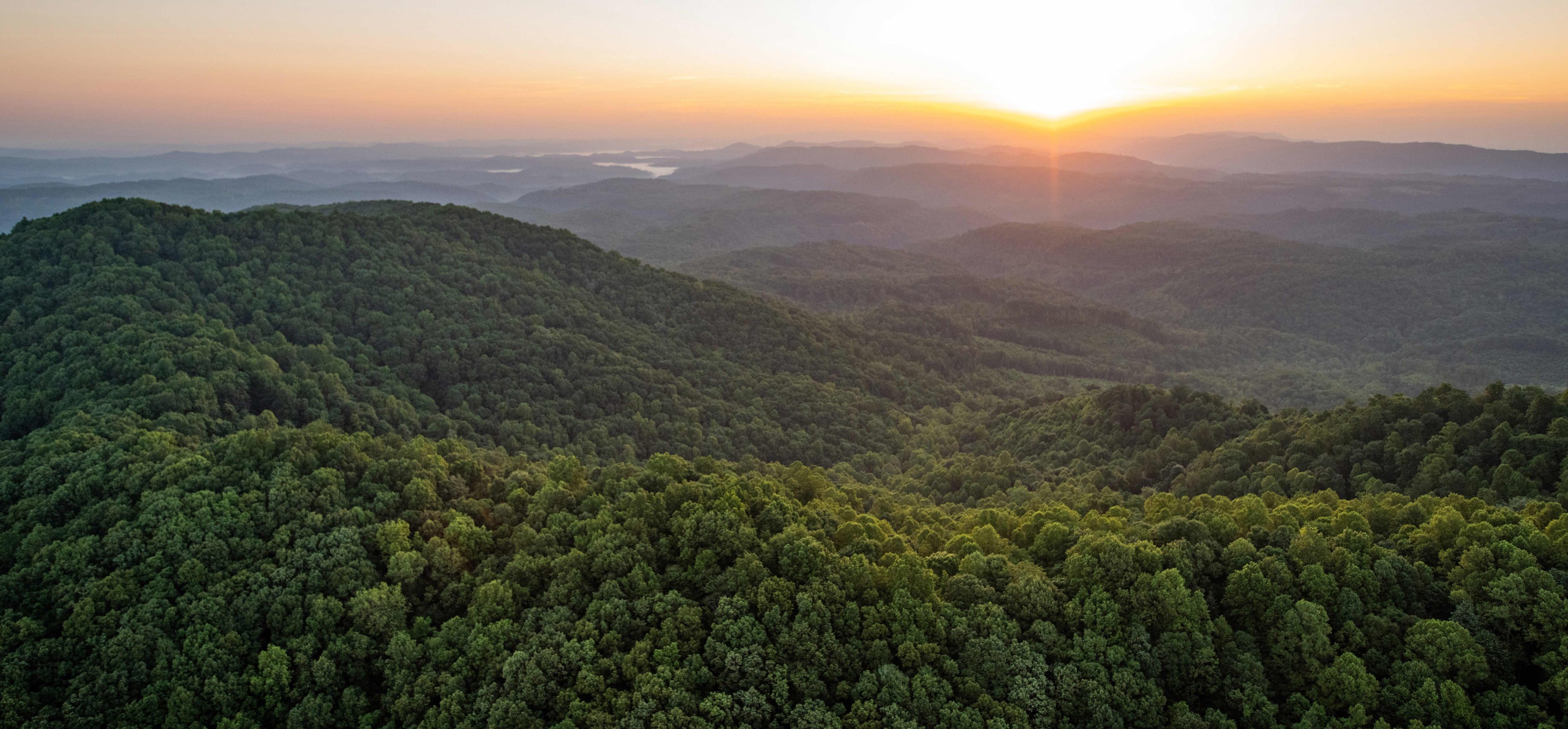 Sunrise aerial image taken near the border of Tennessee and Kentucky of land protected by The Nature Conservancy's Cumberland Forest Project.