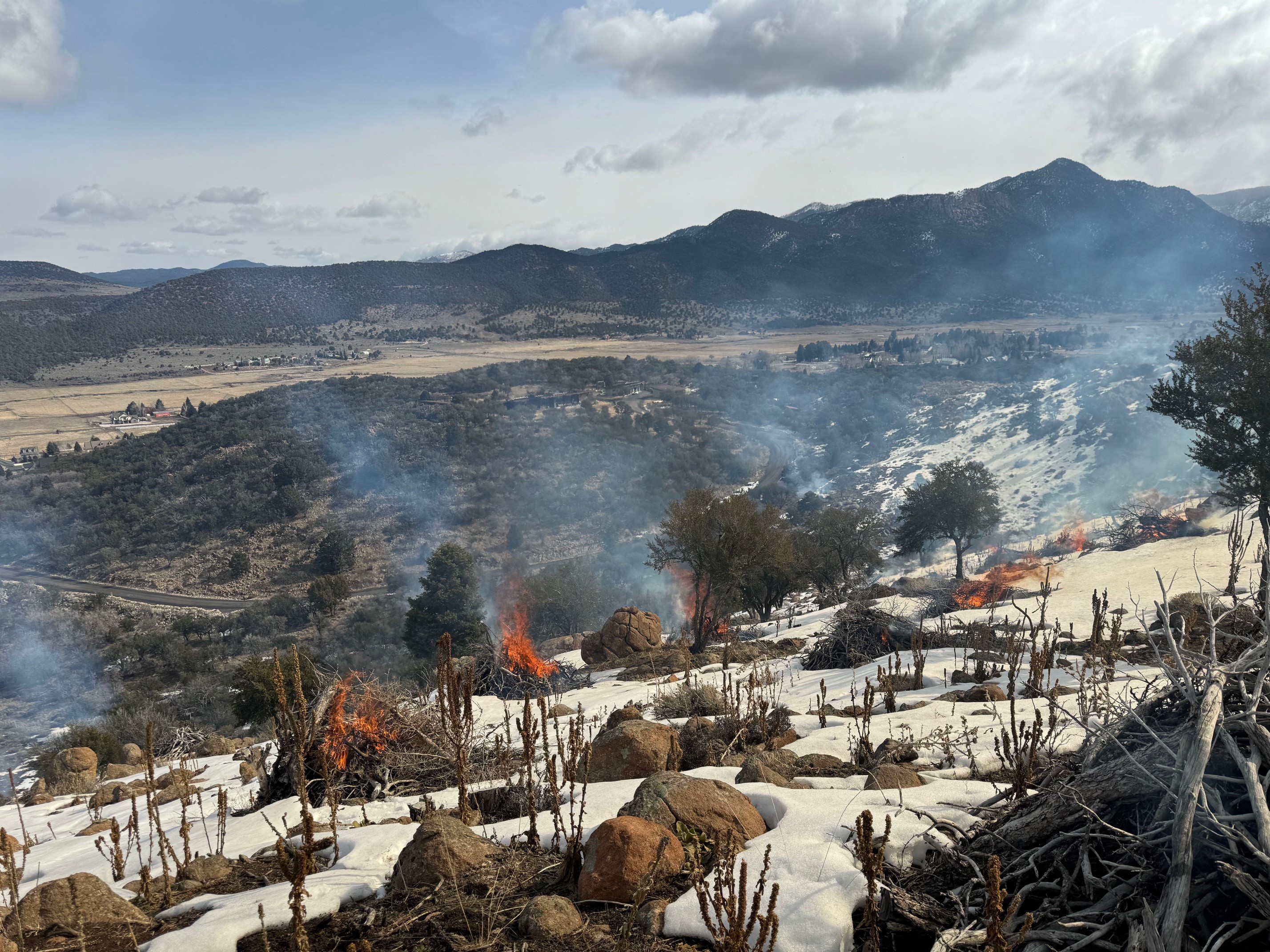 Members of TNC's prescribed fire work force support the Dixie National Forest in a 130-acre pile burn near Pine Alley.